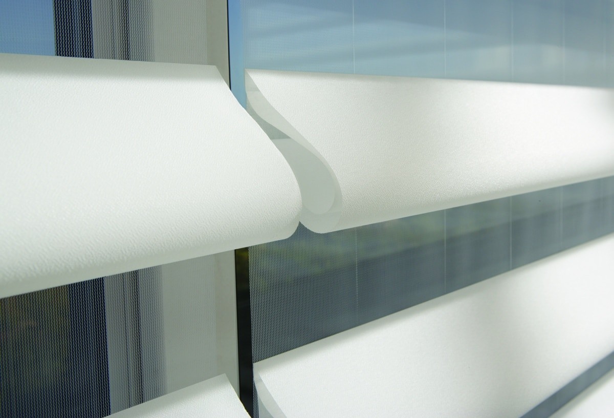 Pirouette shades have strings that disappear into the sheer fabric. Shade fabric folds out.